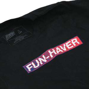 Up close shot of Black Fun-Haver Foundation youth t-shirt with Fun-Haver logo in red, white, and blue printed across the chest.
