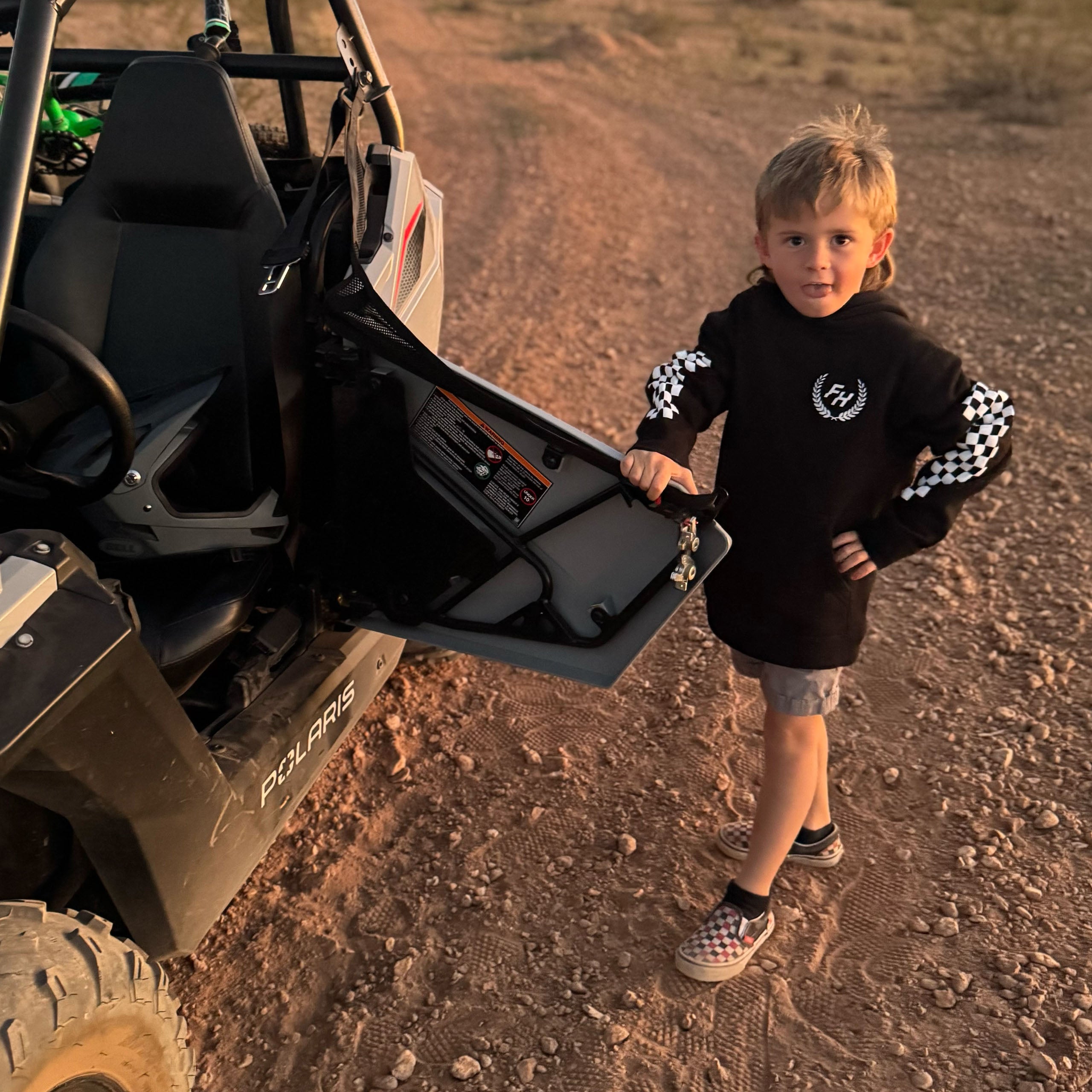 Future Fun-Haver wearing the Black Fun-Haver® Shield Youth Hoodie