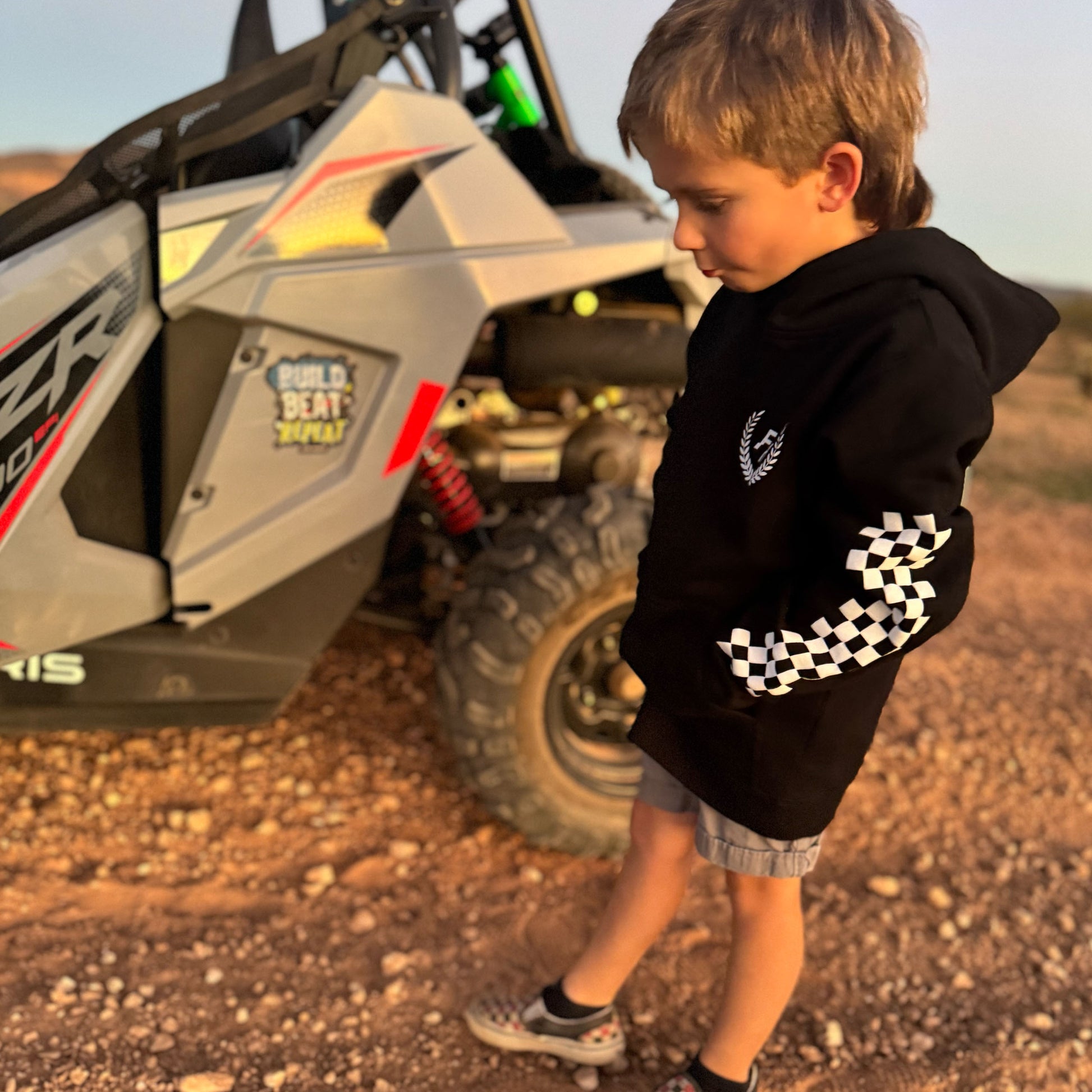 Future Fun-Haver wearing the Black Fun-Haver® Shield Youth Hoodie