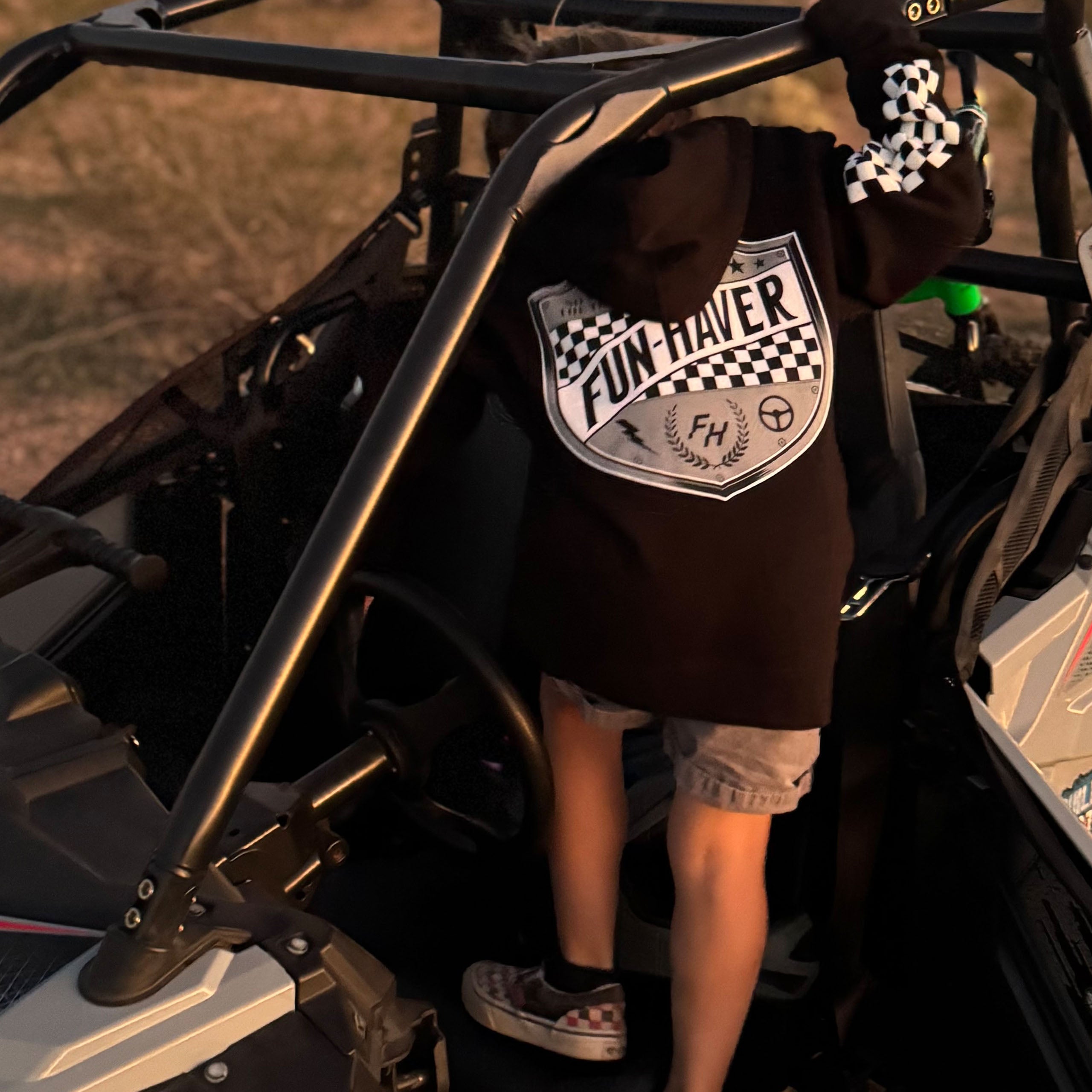 Future Fun-Haver wearing the Black Fun-Haver® Shield Youth Hoodie