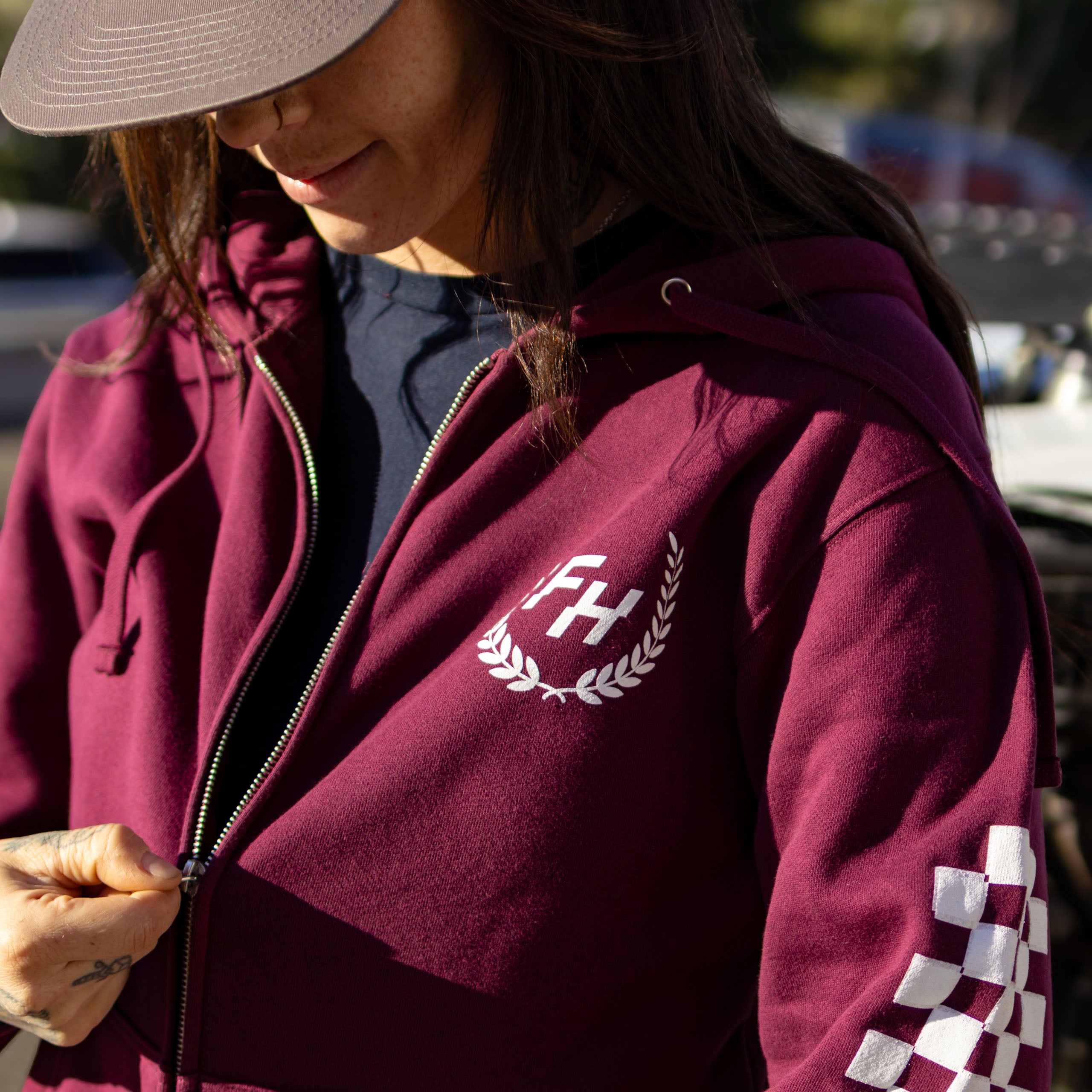 Kelsie Heck wearing the Fun-Haver® Maroon Shield Zip Hoodie