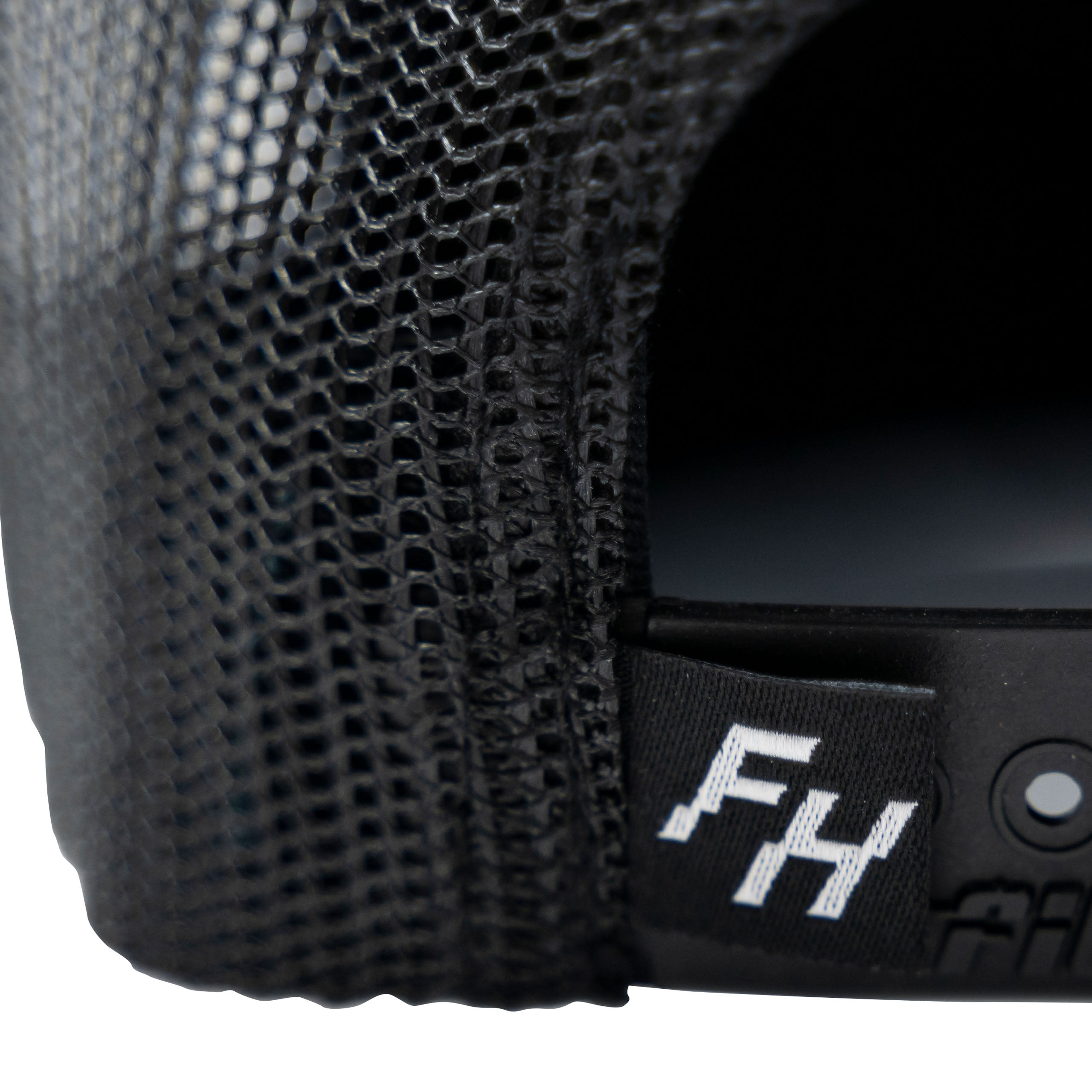 Detail view of the FH logo on the back of the Fun-Haver® Shield 6 Panel Trucker Hat