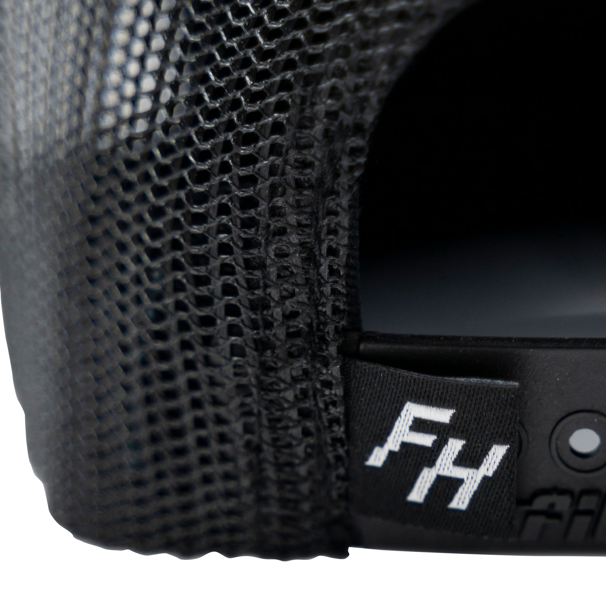 Detail view of the FH logo on the back of the Fun-Haver® Shield 6 Panel Trucker Hat