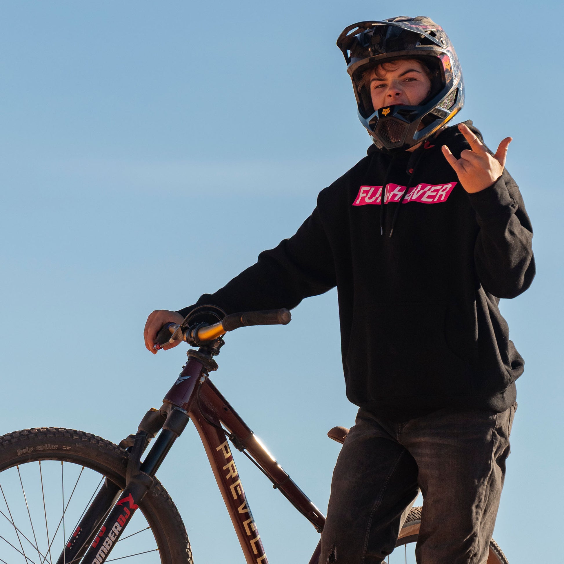 Fun-Haver wearing the Black Fun-Haver Energy Pullover Hoodie getting ready for some two wheel mayhem