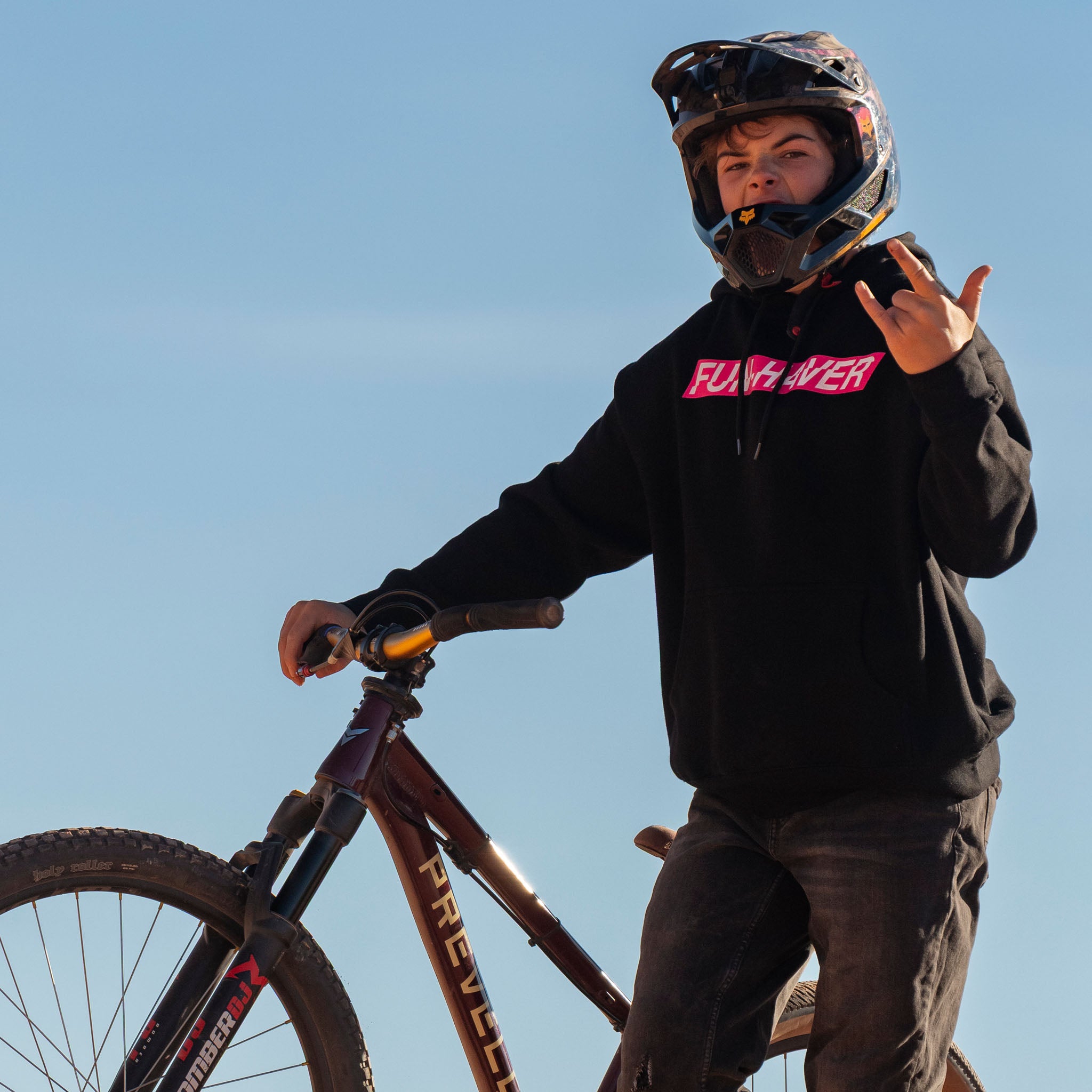 Fun-Haver wearing the Black Fun-Haver Energy Pullover Hoodie getting ready for some two wheel mayhem