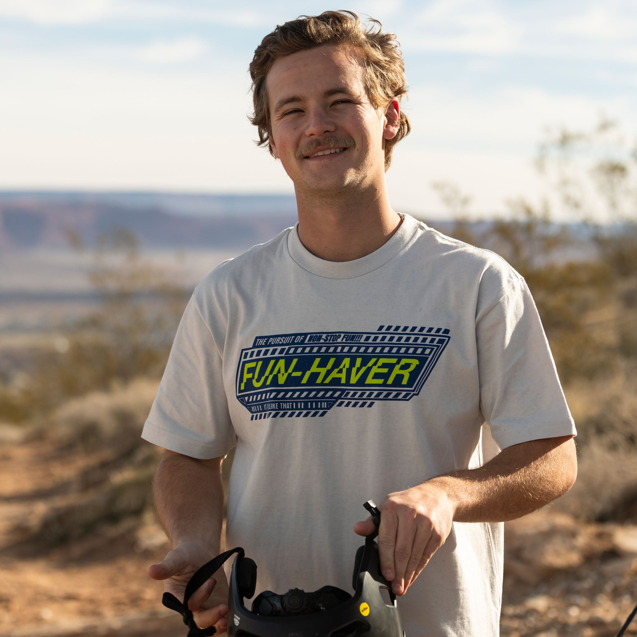 Rider wearing the Fun-Haver Pursuit T-Shirt in Pewter out in the desert ready for some 2 wheel action
