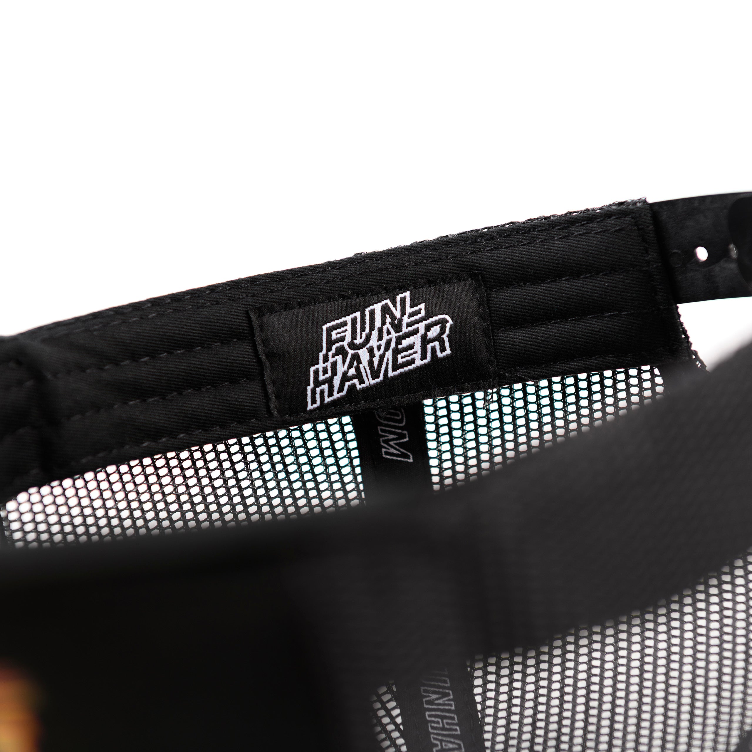 Inside Fun-Haver woven label view of the Black Fun-Haver Thumpers trucker snapback hat.