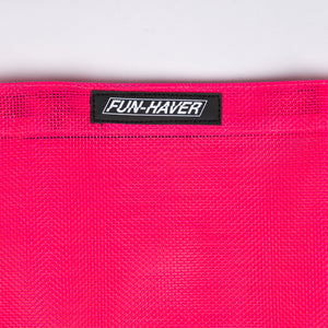 Detail view of the Pink Fun-Haver Trail Bag stitched on Fun-Haver logo tag.