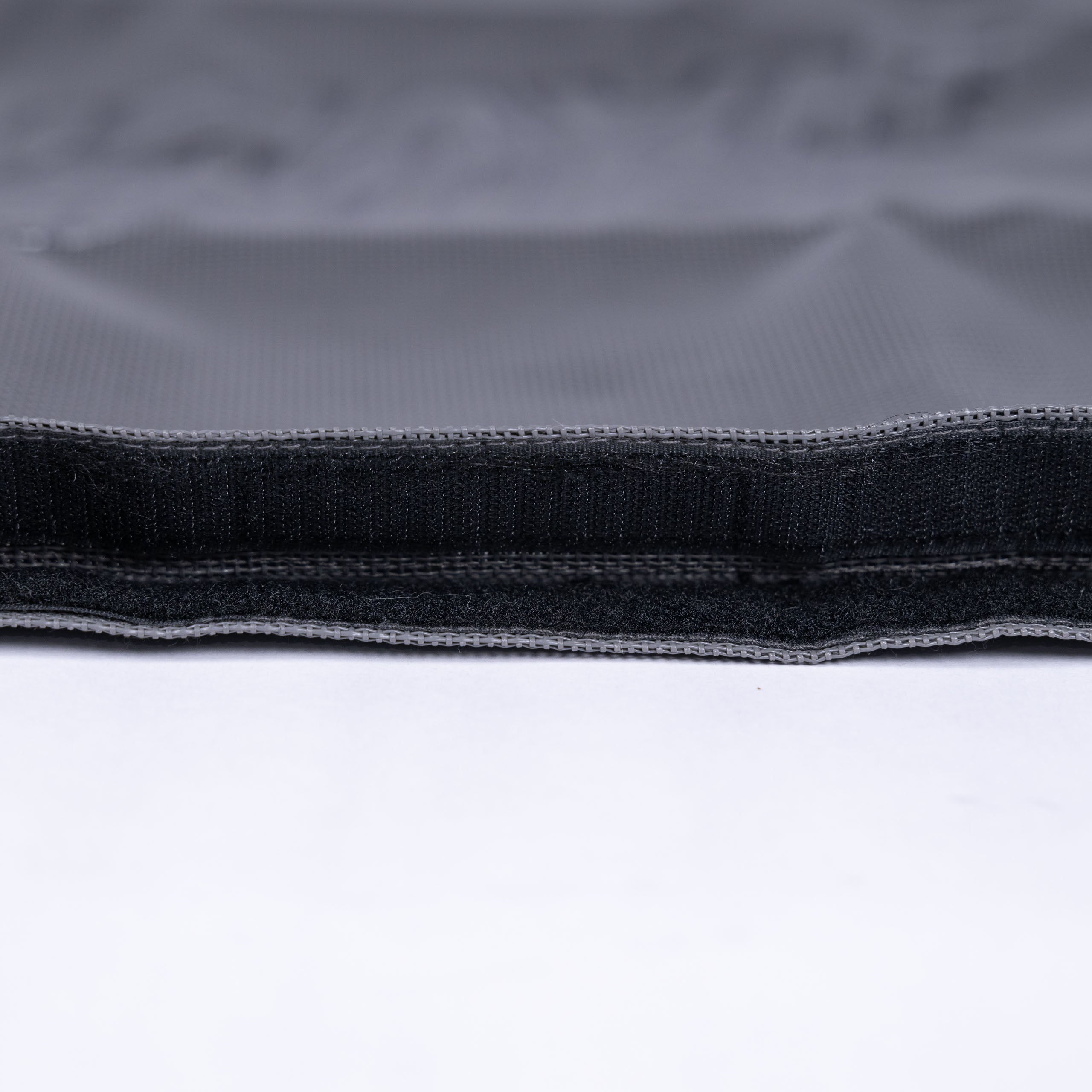 Detail view of the Grey Fun-Haver Trail Bag velcro opening