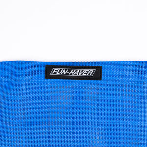Detail view of the Blue Fun-Haver Trail Bag stitched on Fun-Haver logo tag.