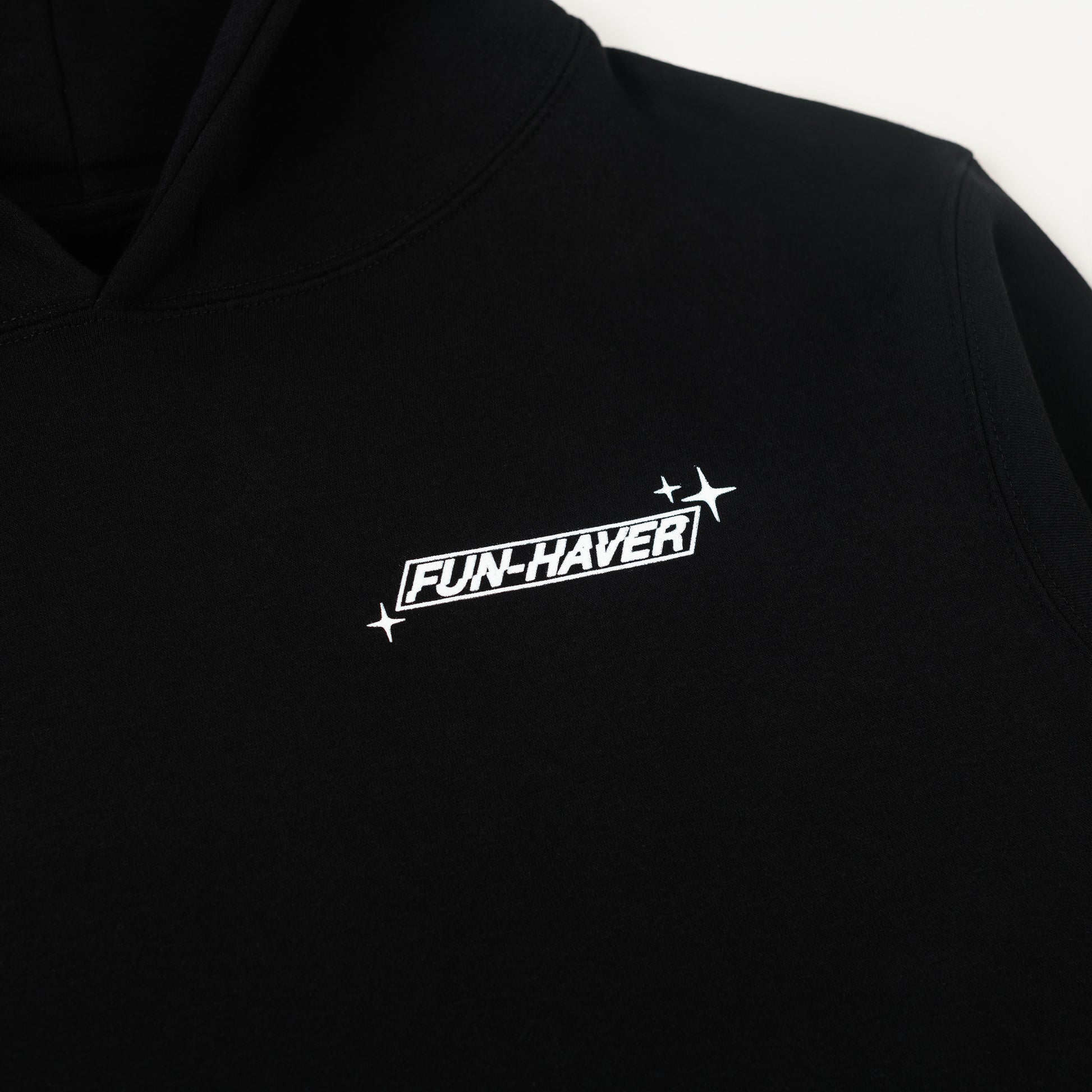 Close up logo detail view of the Fun-Haver Build Beat Repeat Hoodie in Black.