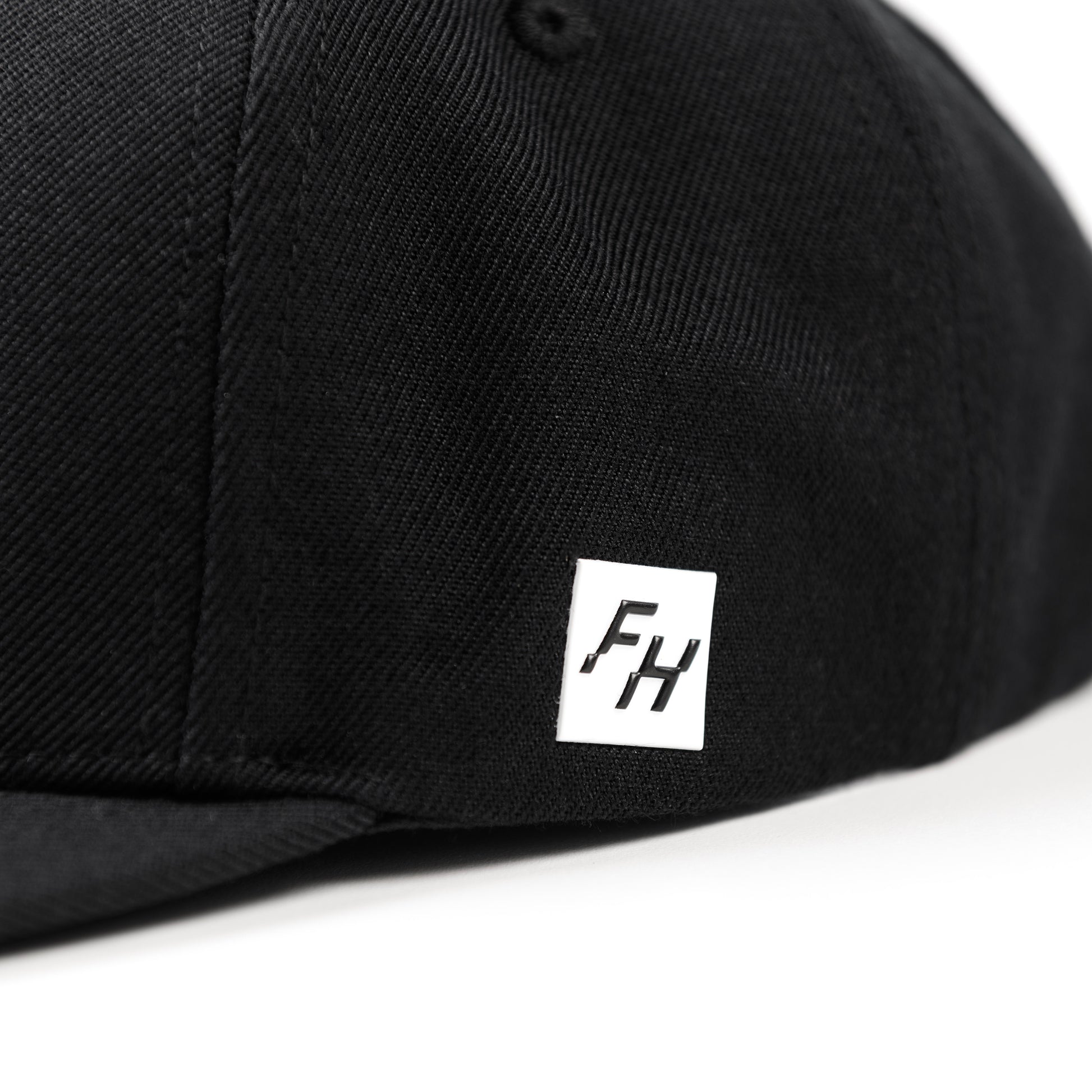 Fun-Haver logo close up view of the Fun-Haver Build Beat Repeat Snapback hat in Black.