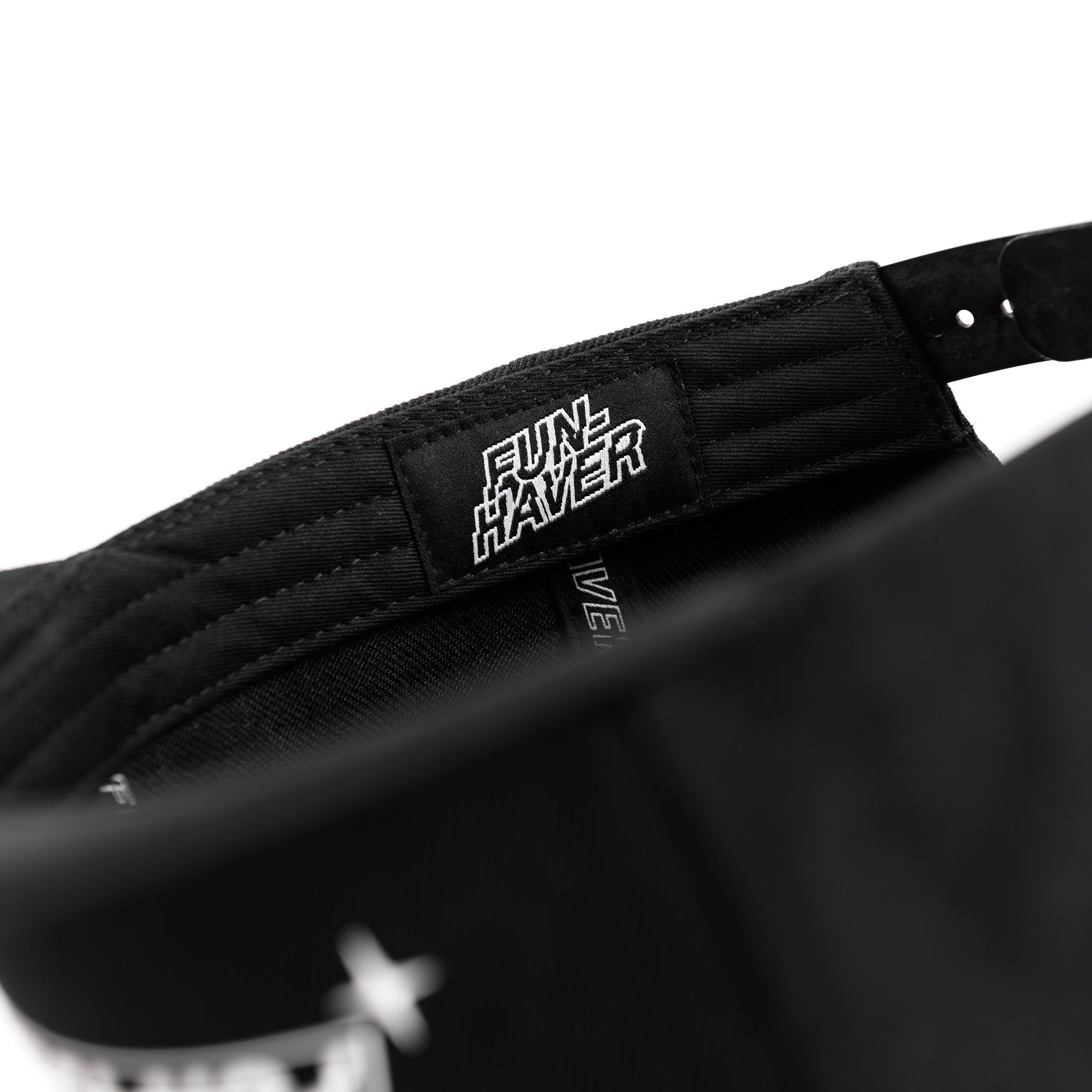 Inside detail view of the Fun-Haver Build Beat Repeat Snapback hat in Black.