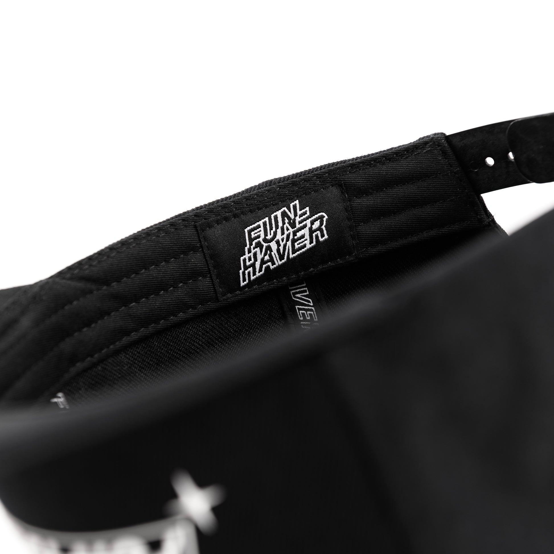 Inside detail view of the Fun-Haver Build Beat Repeat Snapback hat in Black.