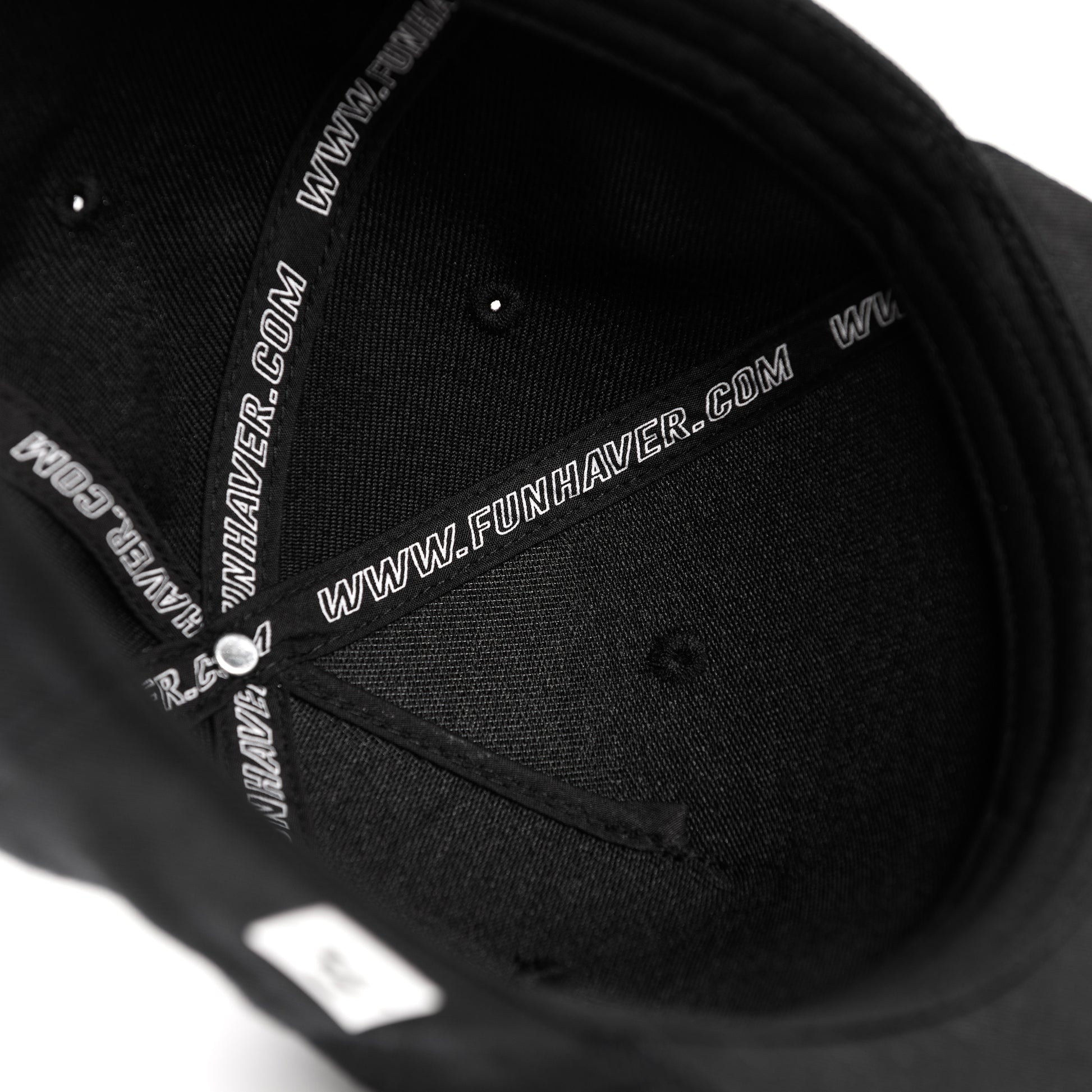 Inside tape view of the Fun-Haver Build Beat Repeat Snapback hat in Black.