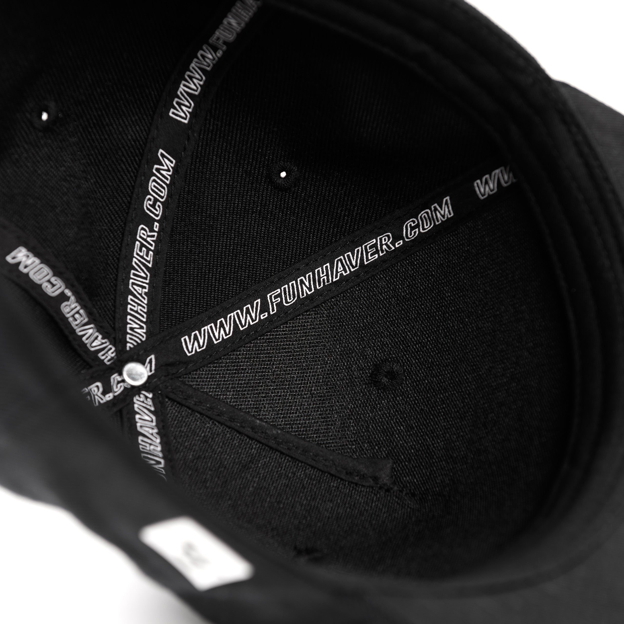 Inside tape view of the Fun-Haver Build Beat Repeat Snapback hat in Black.