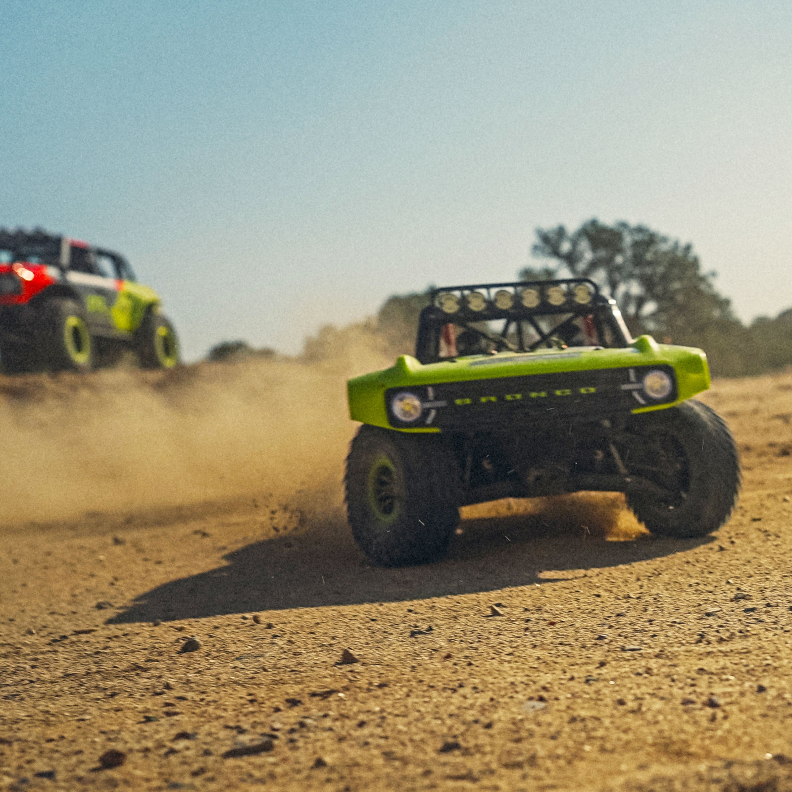 The Fun-Haver FMS Hobby 1:7th scale radio controlled model Ford Bronco truck in action in front of the full sized Ford Bronco.