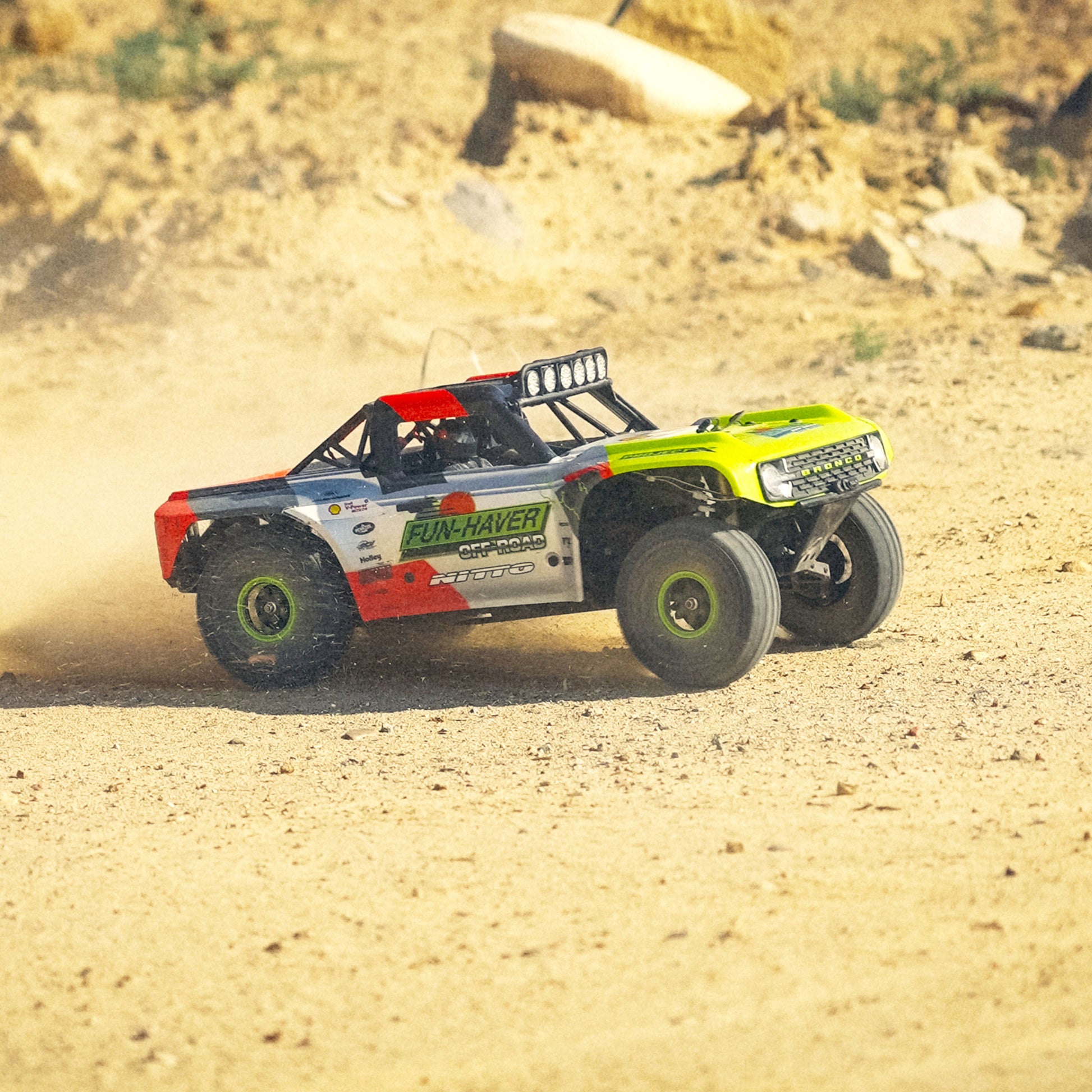 The Fun-Haver FMS Hobby 1:7th scale radio controlled model Ford Bronco truck in action in the dirt.