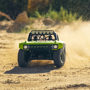 The Fun-Haver FMS Hobby 1:7th scale radio controlled model Ford Bronco going sideways in the dirt.