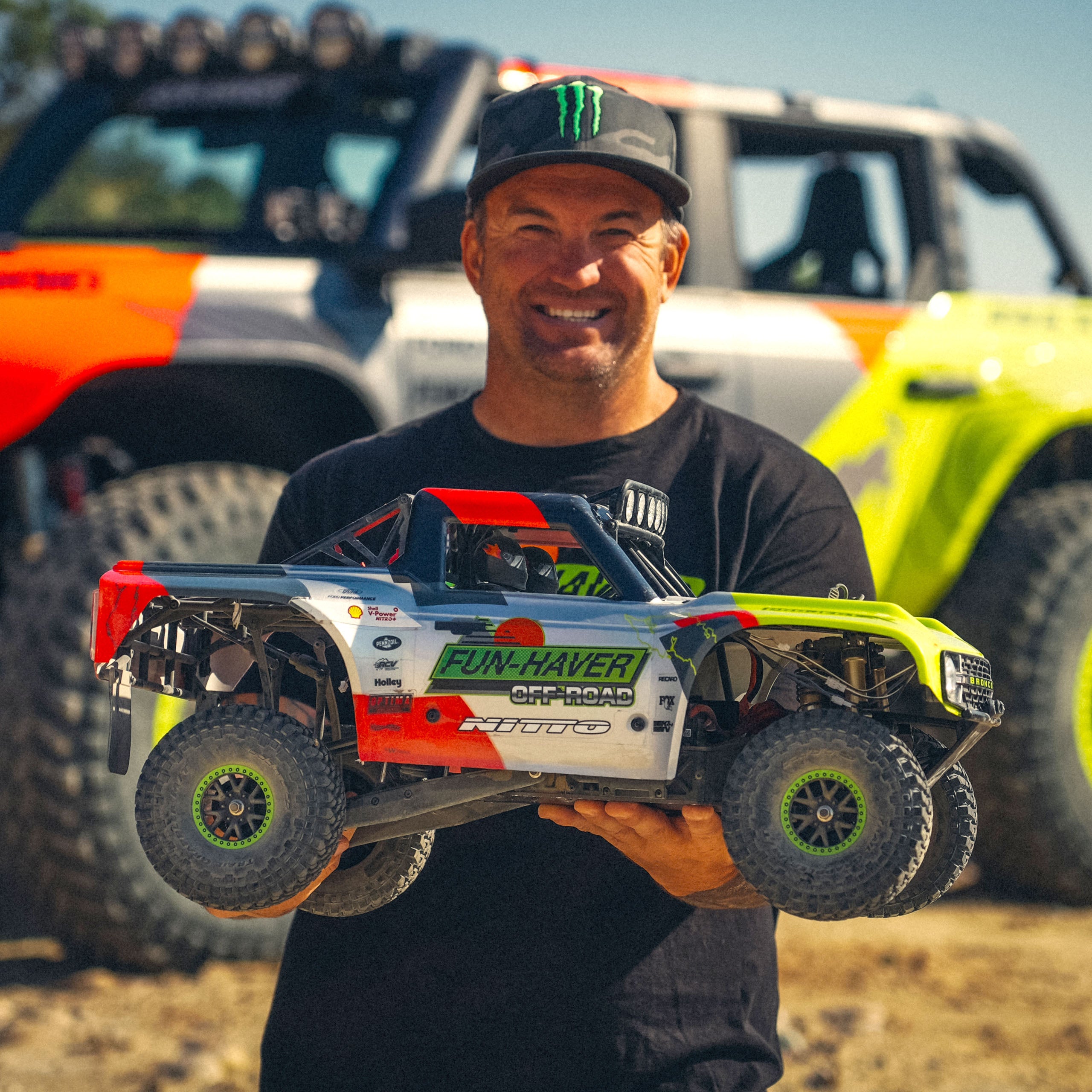 Loren Healy carrying the Fun-Haver FMS Hobby 1:7th scale radio controlled model Ford Bronco truck.