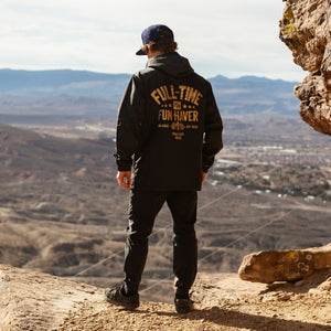 Back view of Joel wearing the Black Full Time Fun-Haver® Winbreaker Coaches Jacket.
