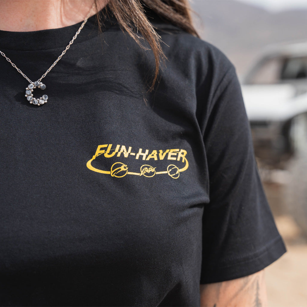 Front view of Kelsie Heck wearing the Fun-Haver Kelsie Heck Build Beat Repeat Black T-Shirt.