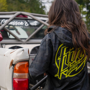 Back view of Kelsie Heck wearing the Fun-Haver® Weekend Windbreaker Anorak Jacket in Black Camo.