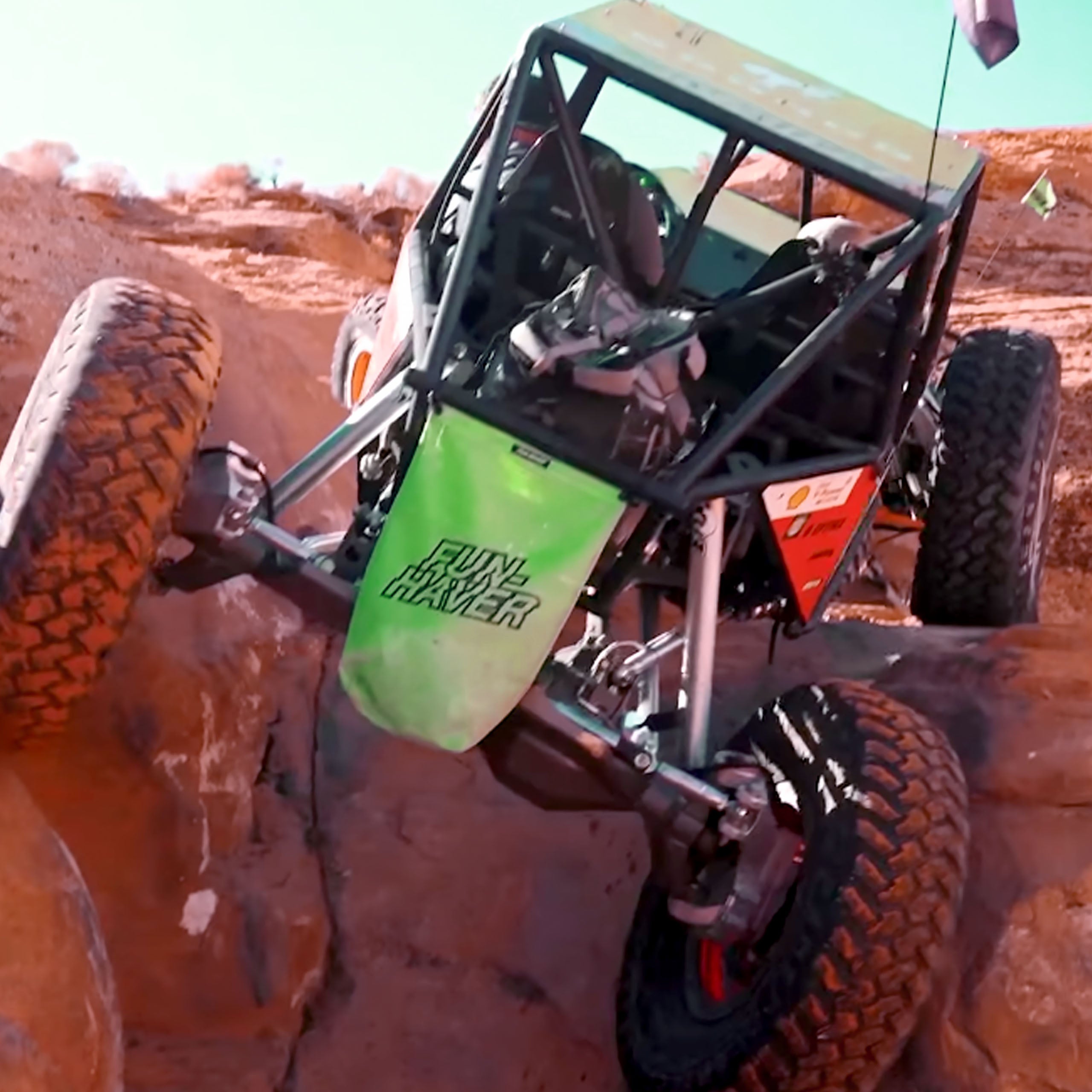 Green Fun-Haver Trail Bag in the wild on an off-road rig on the rocks.