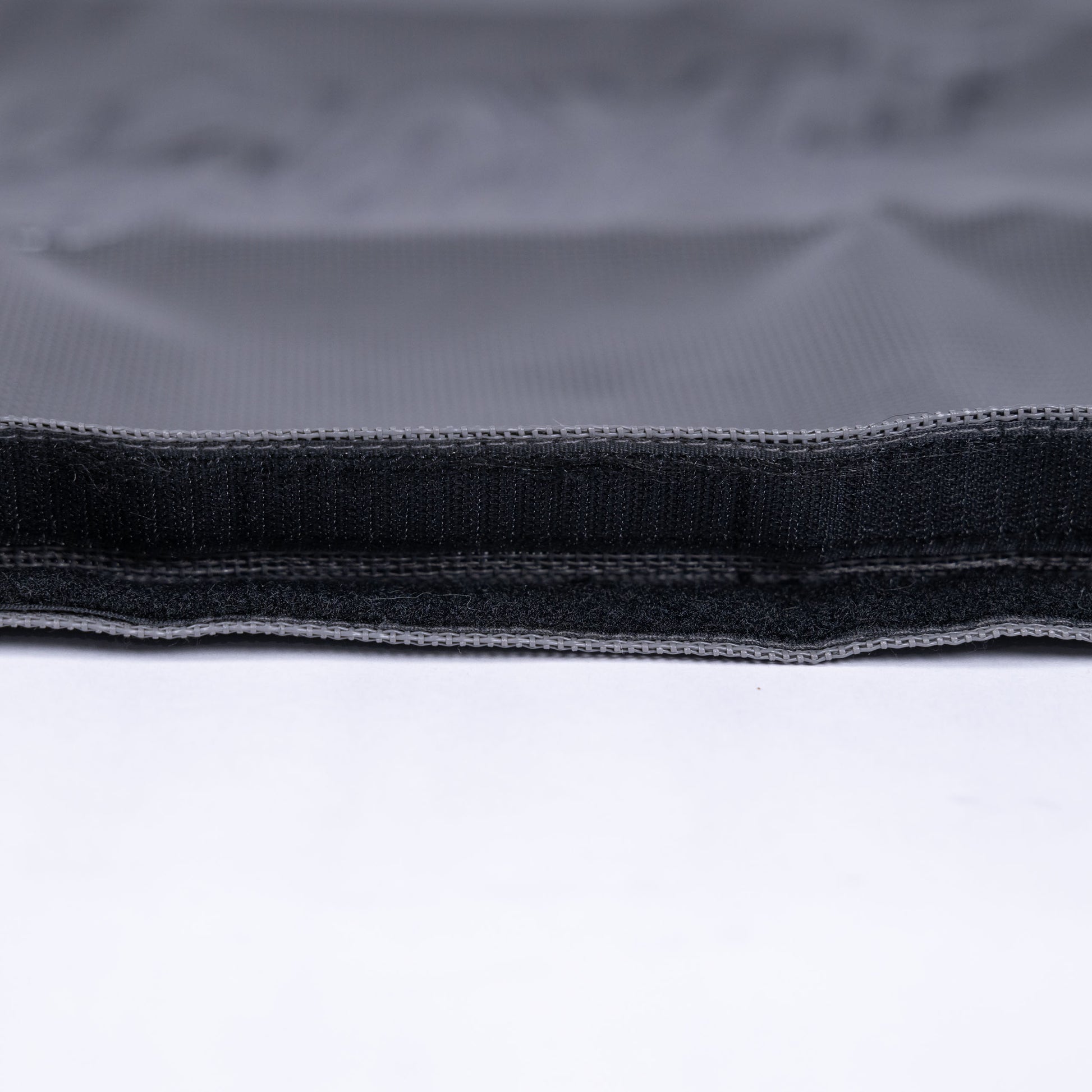 Detail view of the Grey Fun-Haver Trail Bag velcro opening