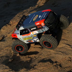 Peeking into the cockpit of the Fun-Haver Loren Healy Hpi Venture 18 1/10th RC Ultra4 Bronco in action in the early evening sun.