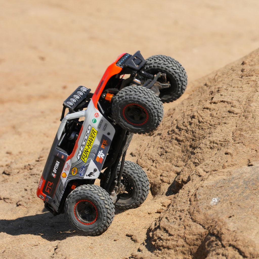 The Fun-Haver Loren Healy Hpi Venture 18 1/10th RC Ultra4 Bronco popping a wheelie up the hill.