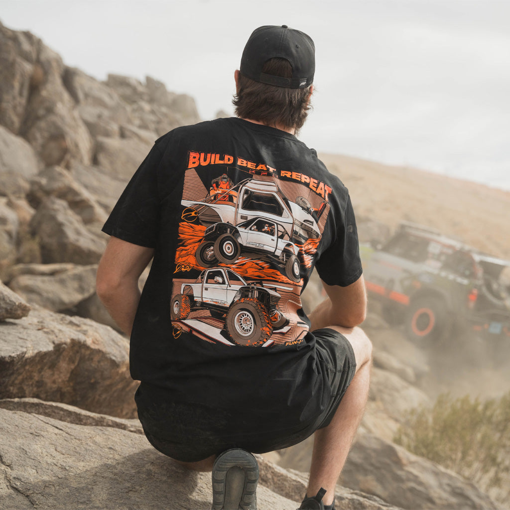 Back view of man wearing the Fun-Haver Kelsie Heck Build Beat Repeat Black T-Shirt.