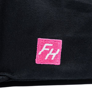 Detail view of the embroidered FH logo on the Fun-Haver Energy Snapback Hat.