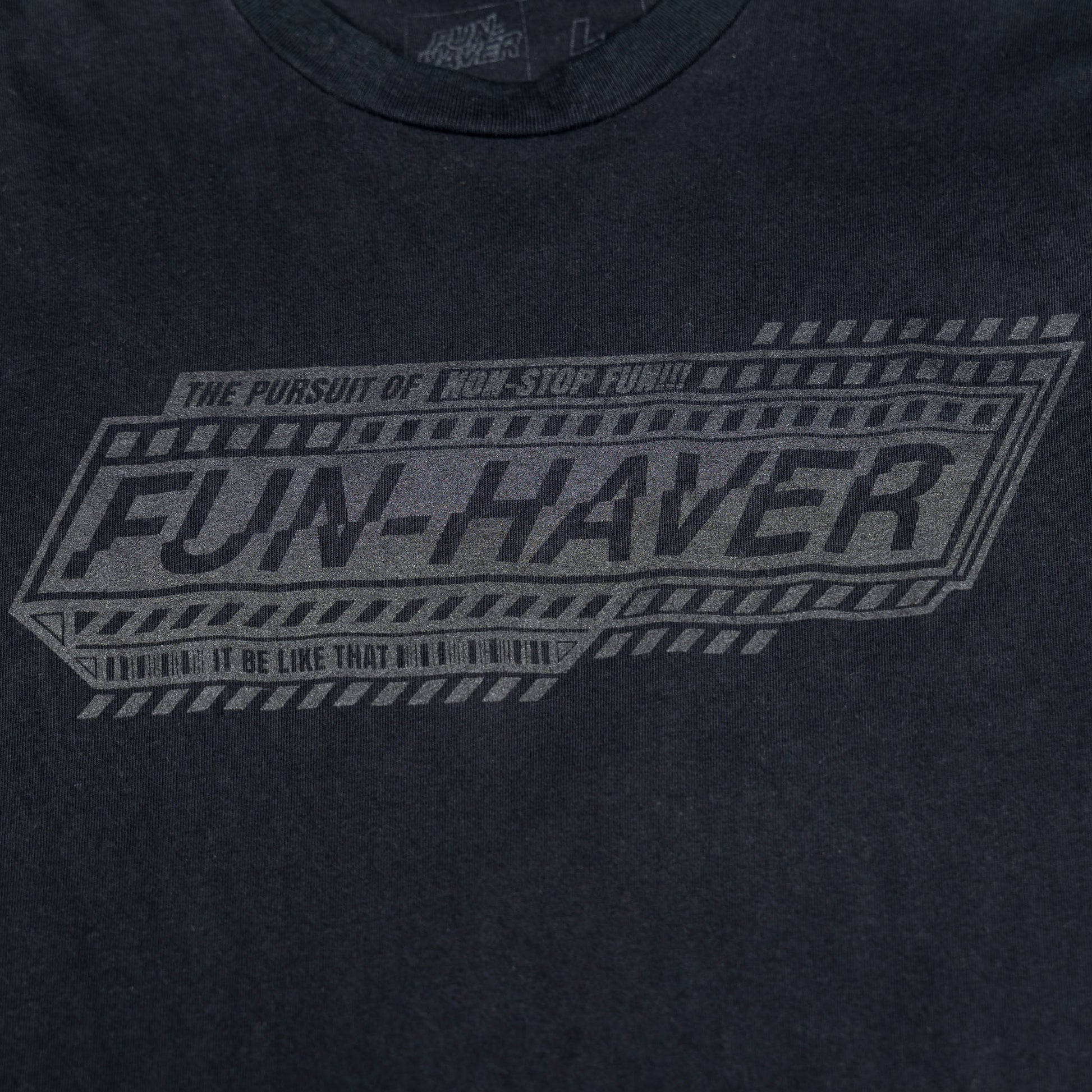 Detail front view of the Fun-Haver Pursuit Black T-Shirt.