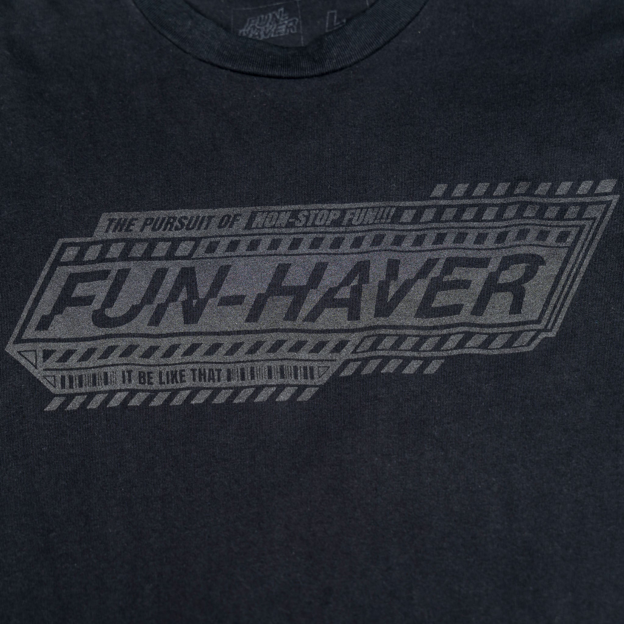 Detail front view of the Fun-Haver Pursuit Black T-Shirt.
