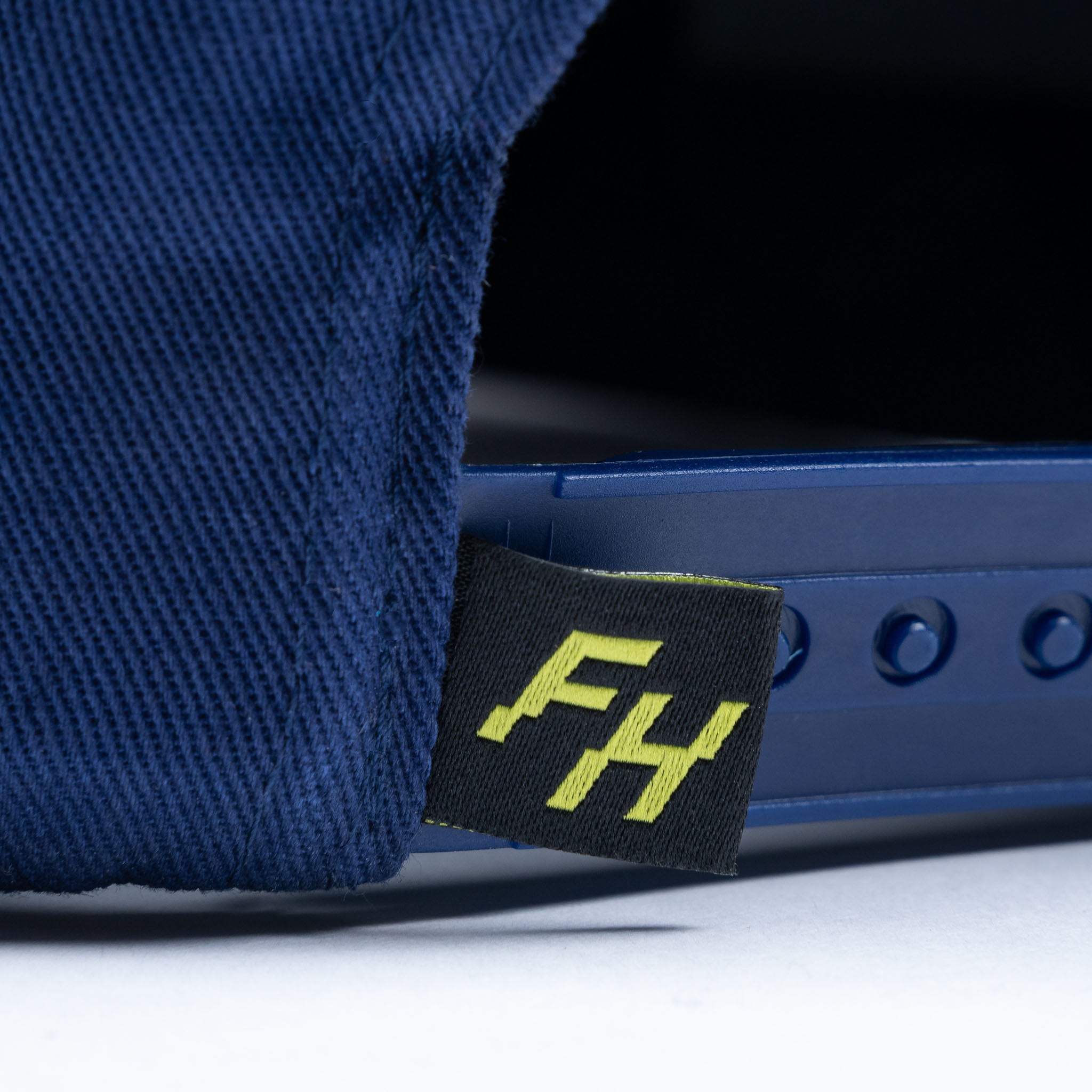 Snapback detail view of the Navy Fun-Haver Pursuit Snapback Hat.