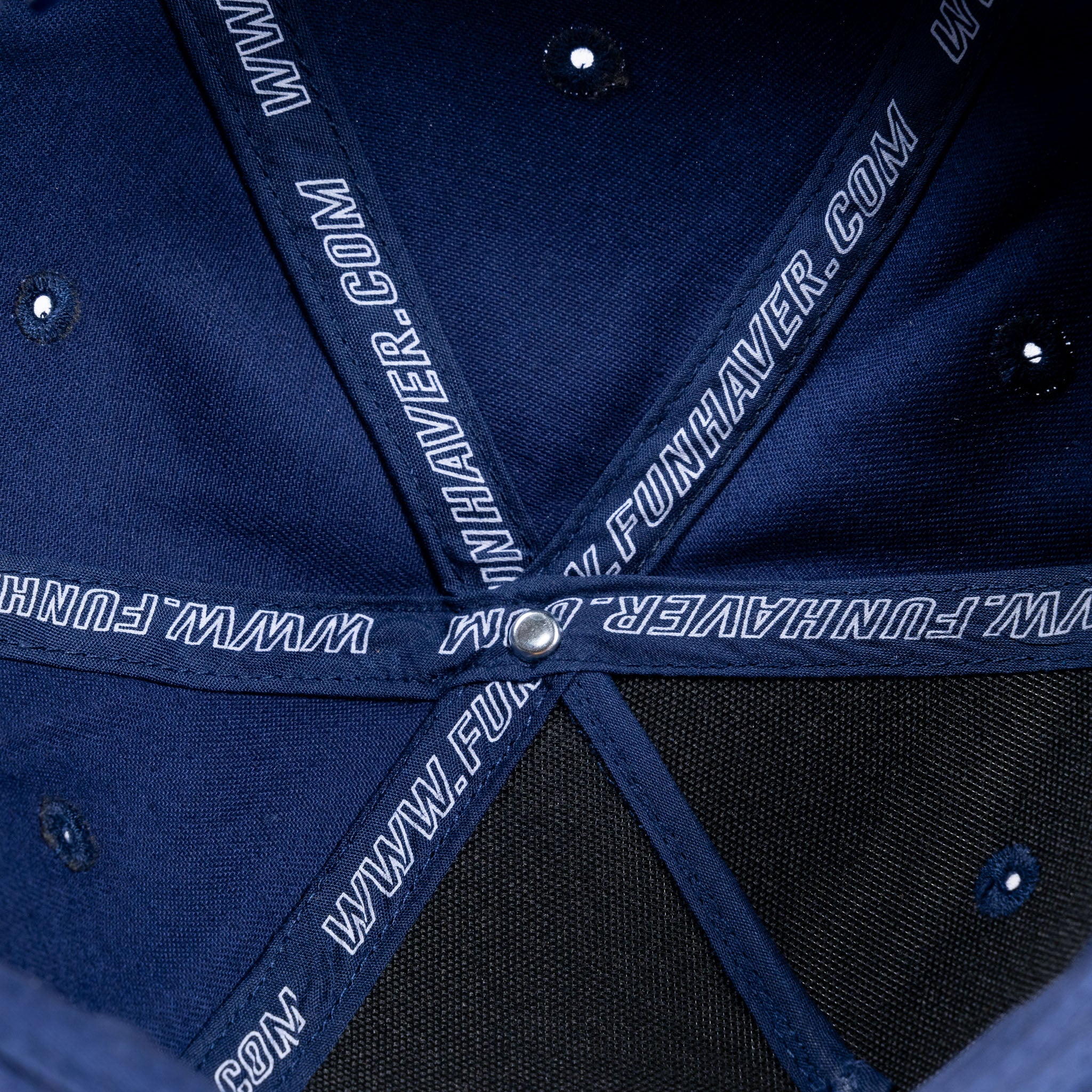 Inside detail view of the Navy Fun-Haver Pursuit Snapback Hat.