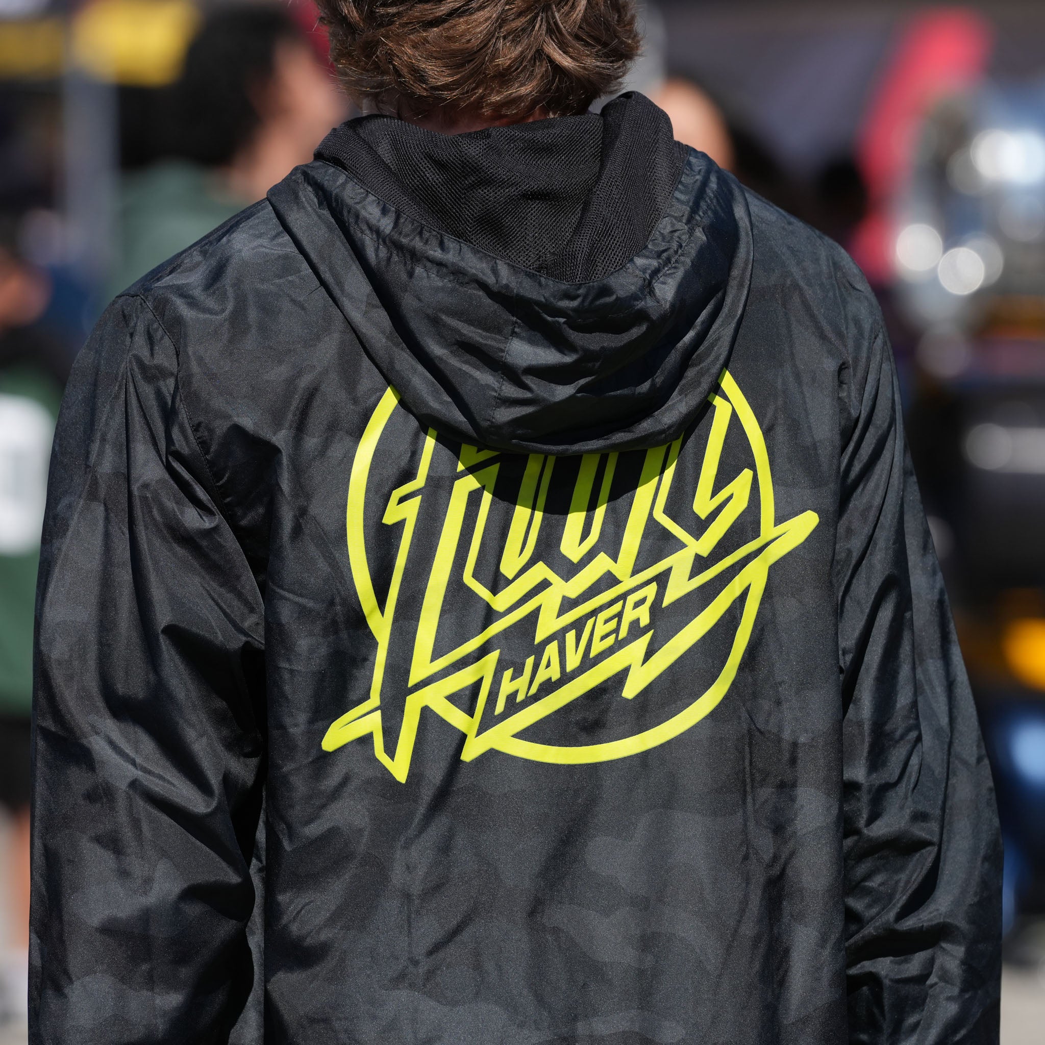Back view of Rhys Conklin wearing the Fun-Haver® Weekend Windbreaker Anorak Jacket in Black Camo at Formula Drift Long Beach.