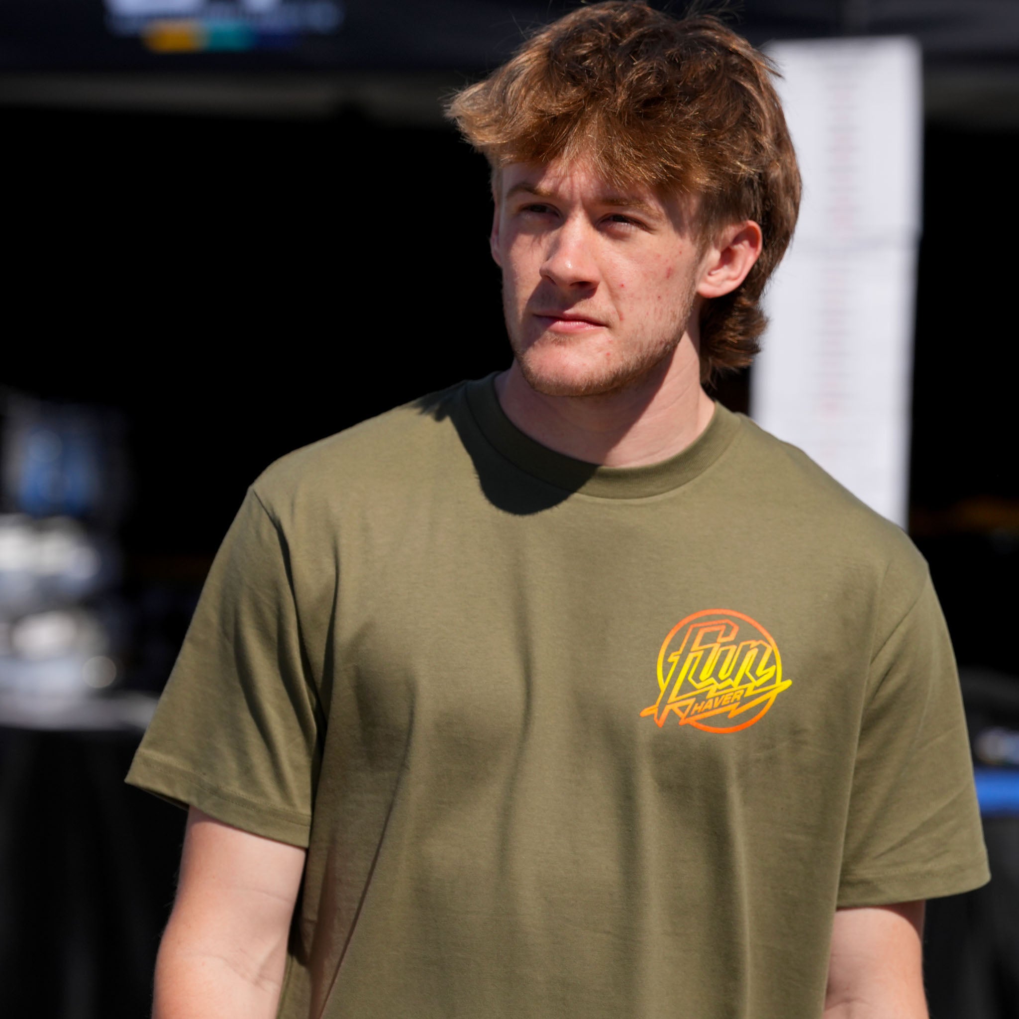 Rhys Conklin wearing the Fun-Haver Weekend Short Sleeve T-Shirt in Military Green at Formula Drift Long Beach.