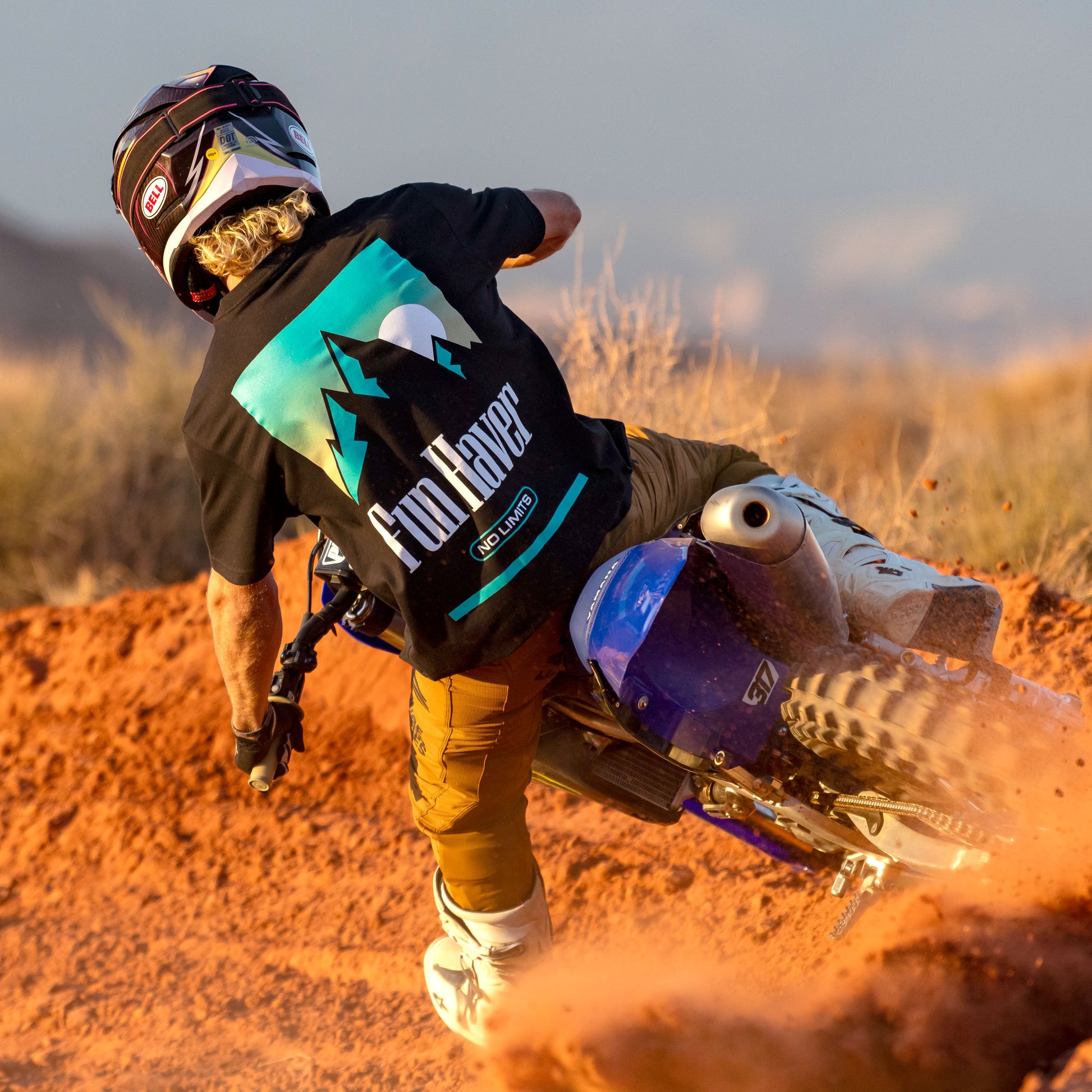 Back view of a motocross rider wearing the Fun-Haver No Limits Black T-Shirt.