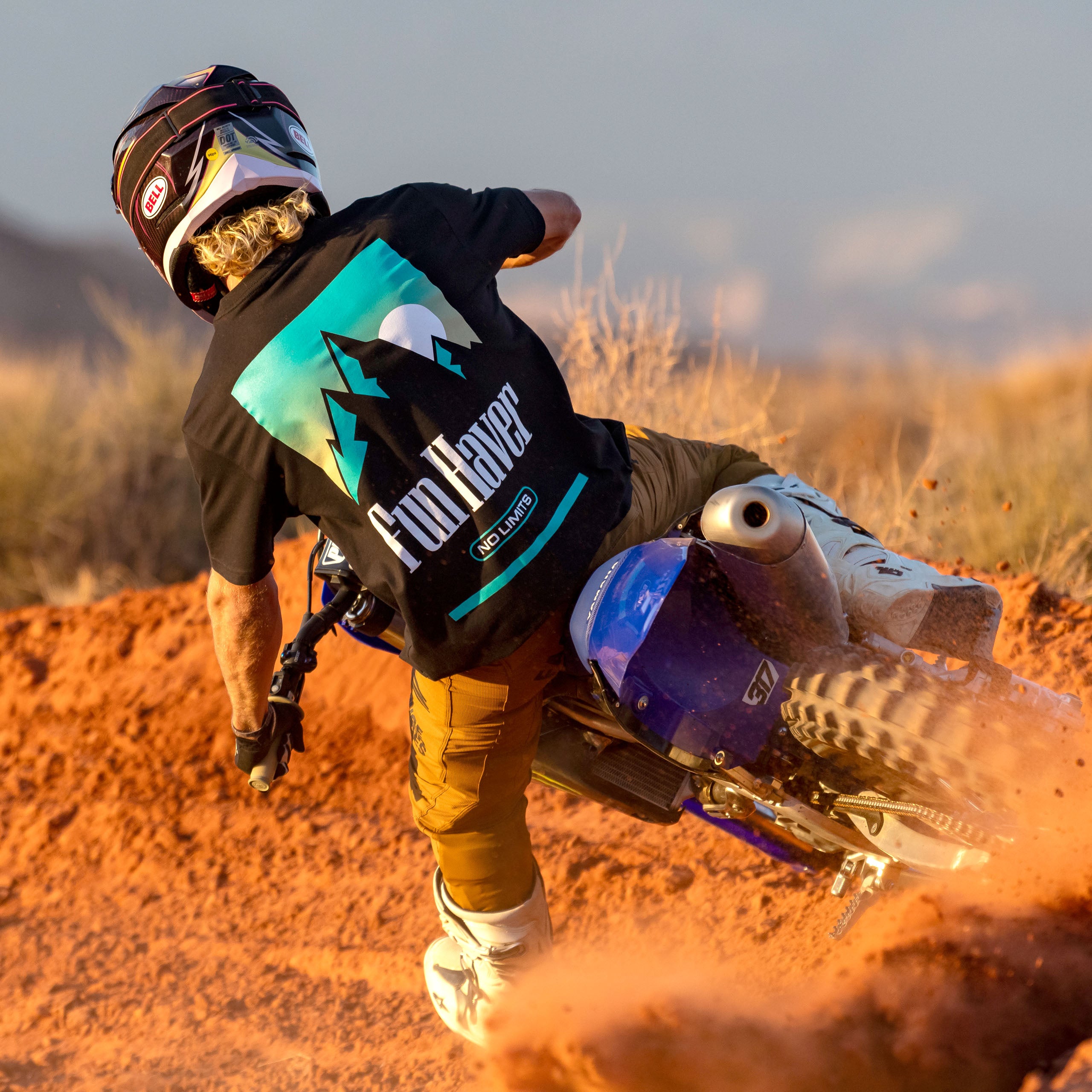 Back view of a motocross rider wearing the Fun-Haver No Limits Black T-Shirt.