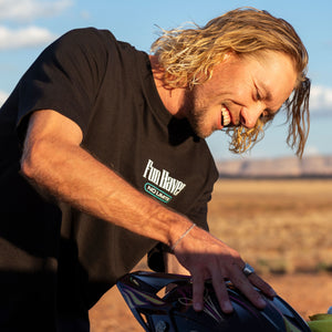 Front view of motocross rider wearing the Fun-Haver No Limits Black T-Shirt while getting his gear ready.