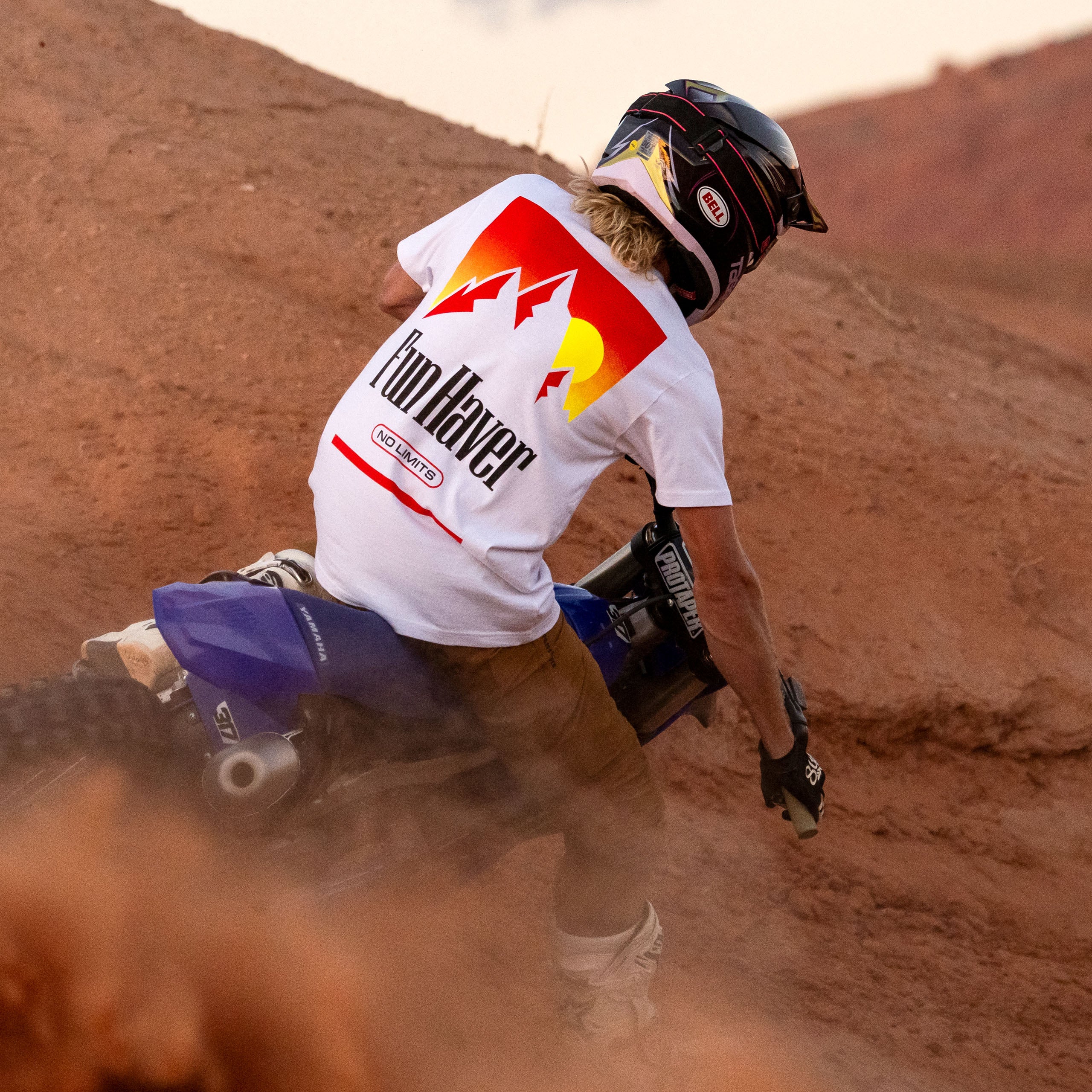 Back view of a motocross rider wearing the Fun-Haver No Limits White T-Shirt.