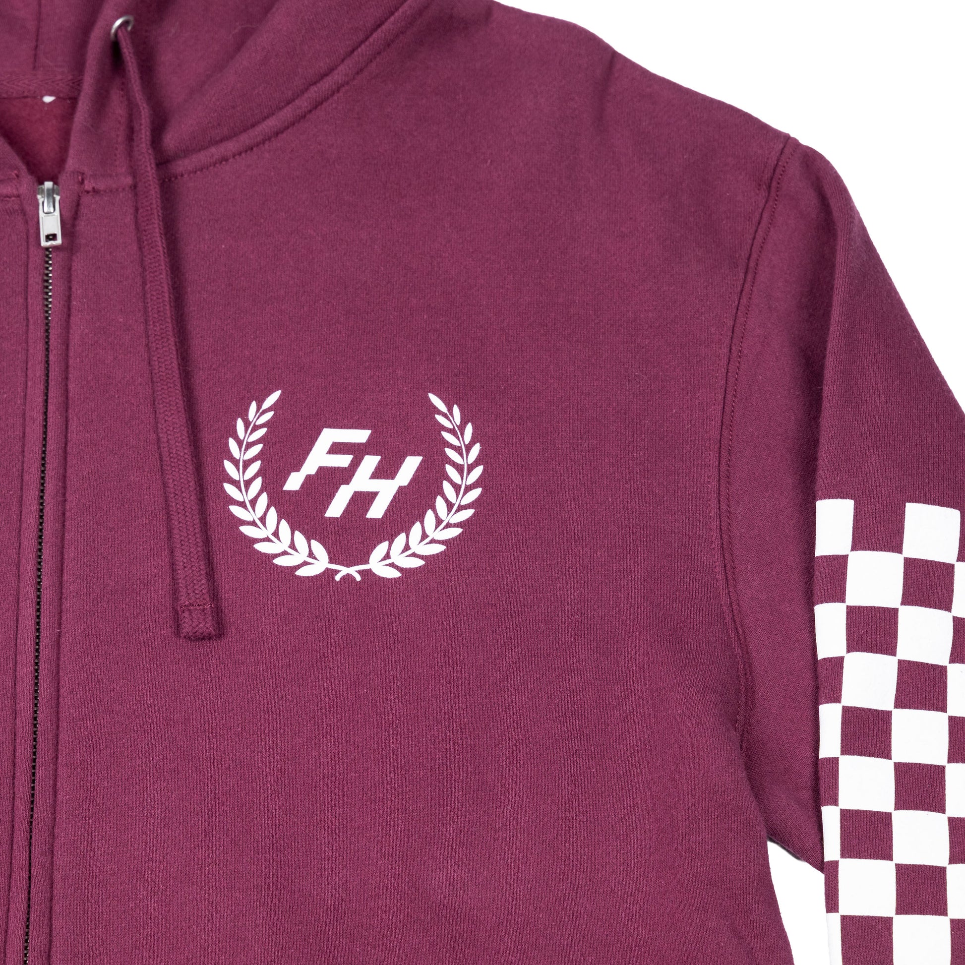 Front view of the Fun-Haver logo detail on the Fun-Haver Shield logo Maroon zip hoodie.