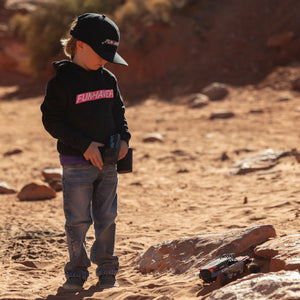 Future Fun-Haver wearing the Energy Black Youth Pullover Hoodie while driving the Hpi Racing Radio Controlled Loren Healy Ultra4.