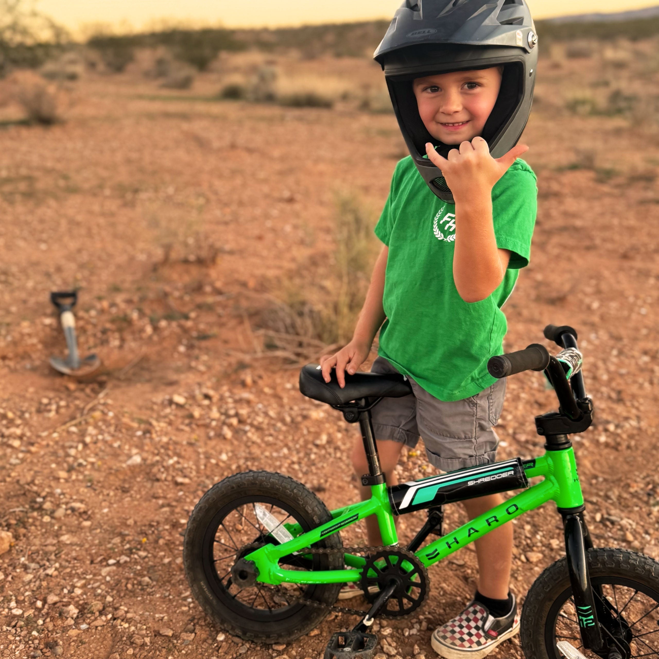Front view of future Fun-Haver wearing the Fun-Haver® Kelly Green Shield Logo Youth T-Shirt.