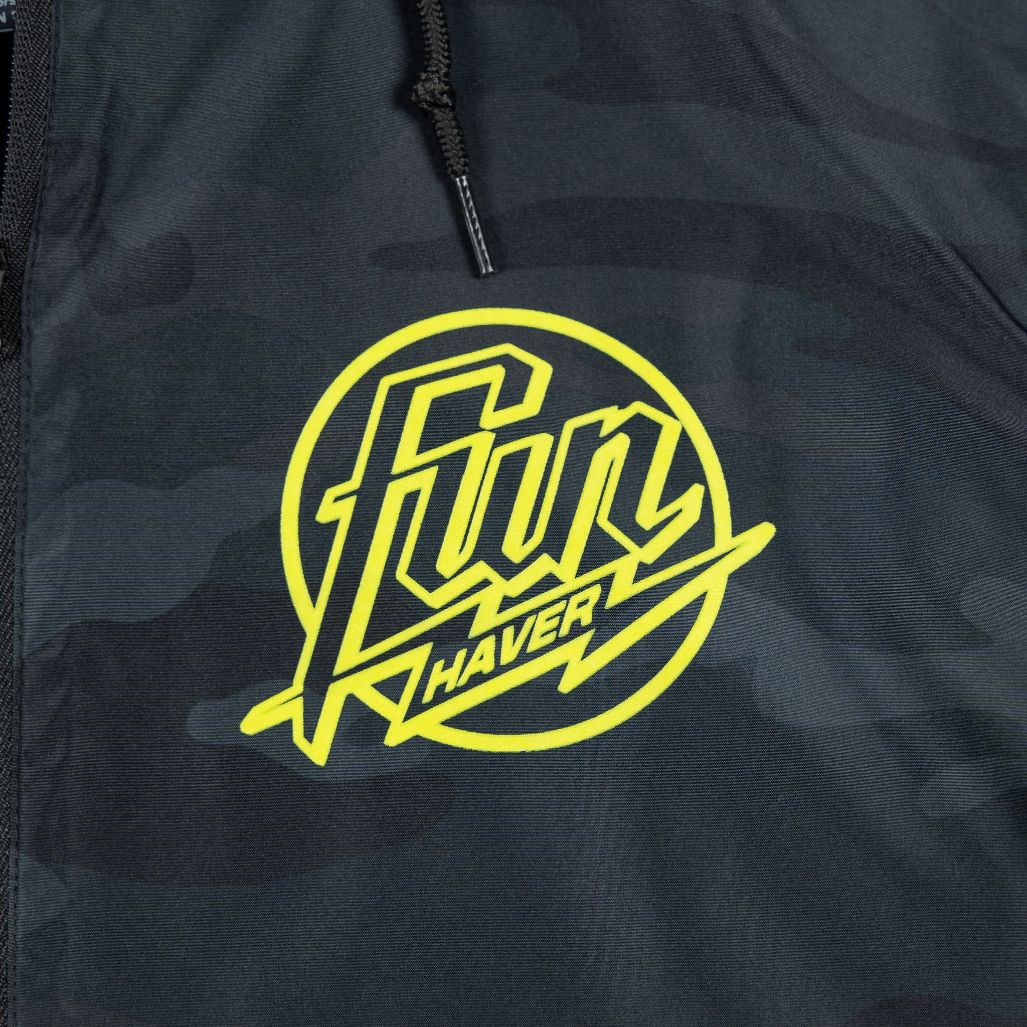 Front logo detail view of the Fun-Haver® Weekend Windbreaker Anorak Jacket in Black Camo.