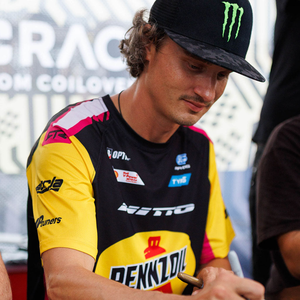 Ben Hobson signing autographs wearing the 2026 RTR Drift Team Sublimated Shirt at a Formula Drift event.