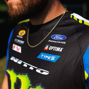 Close up view of an RTR Vehicles team member in the 2026 Vaughn Gittin Jr. Drift Team Sublimated shirt at a Formula Drift event.